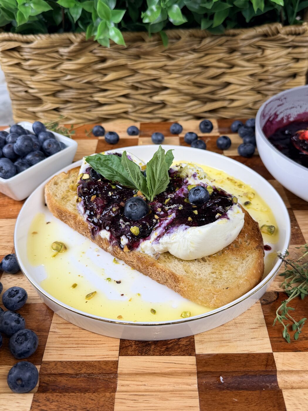 Burrata toast with blueberry compote, pistachios and basil